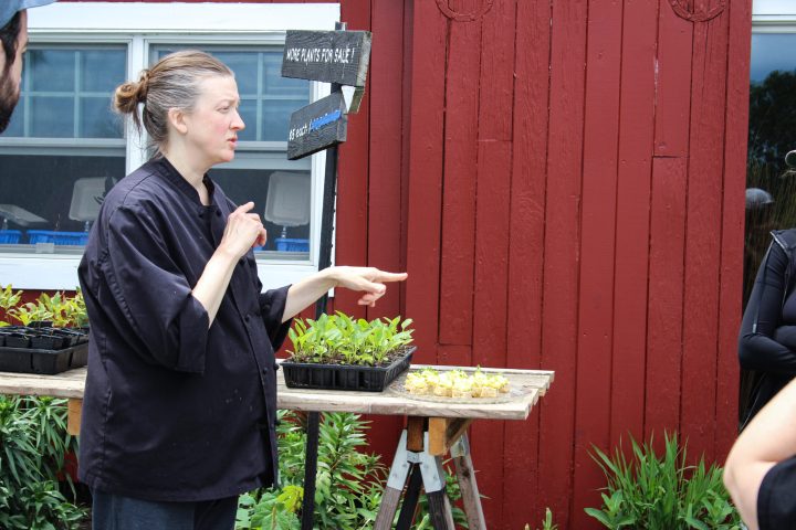 a woman standing in front of a building