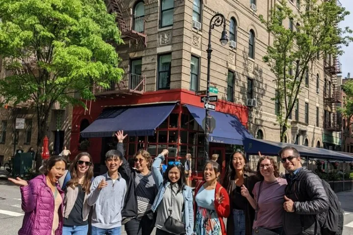 a group of people standing in front of a building