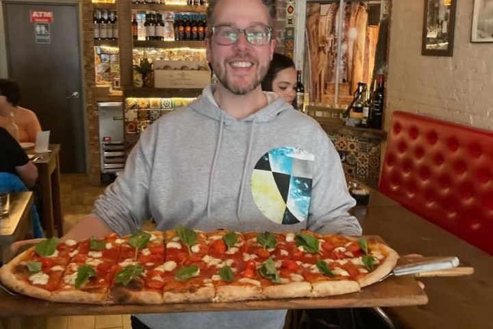 a person standing in front of a store