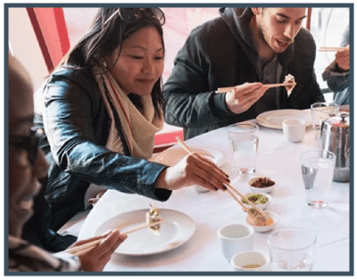 a group of people sitting at a table