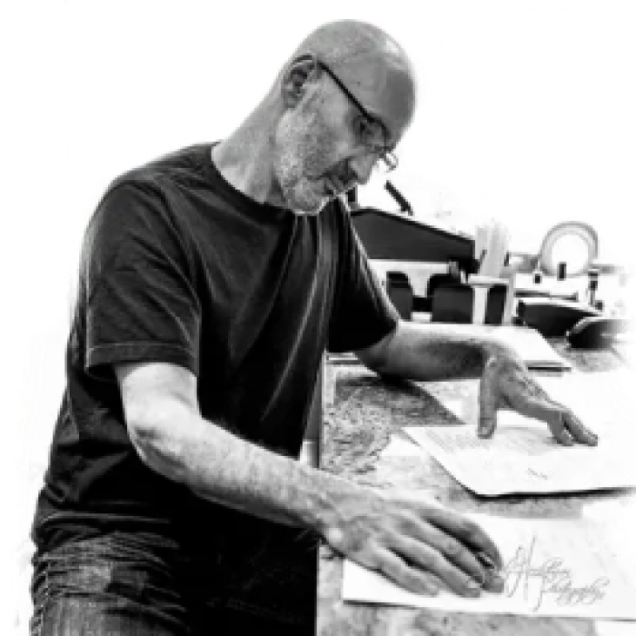 todd-isolated-400×400-1 1 a man standing next to a knife