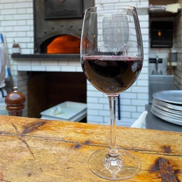 a glass of wine on a table