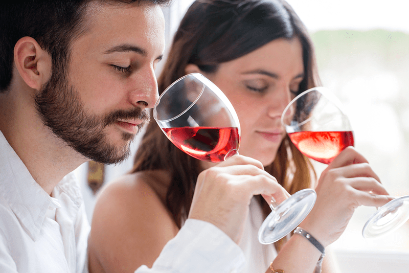 exclusive-wine-tasting-experiences-in-new-york a woman drinking a glass of wine